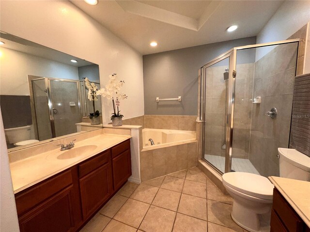 full bathroom featuring tile patterned flooring, independent shower and bath, vanity, and toilet