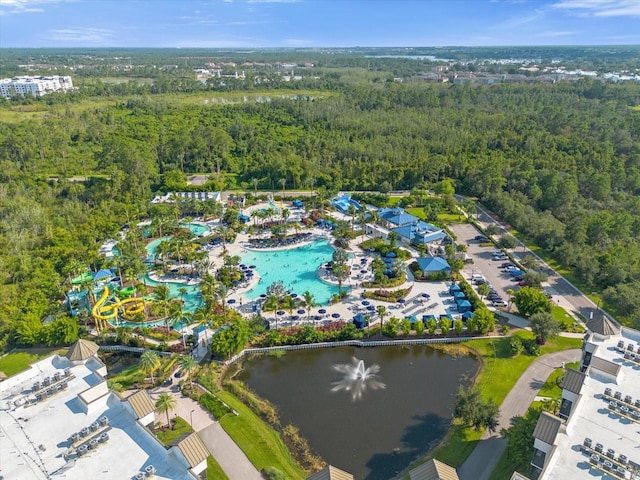 bird's eye view with a water view and a view of trees