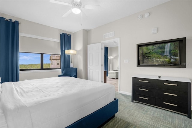 bedroom featuring visible vents, ceiling fan, light carpet, and baseboards