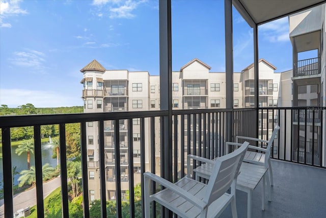 balcony featuring a water view