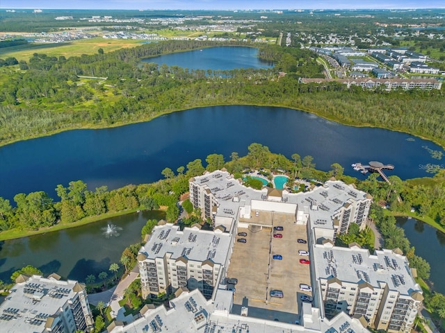 birds eye view of property with a water view