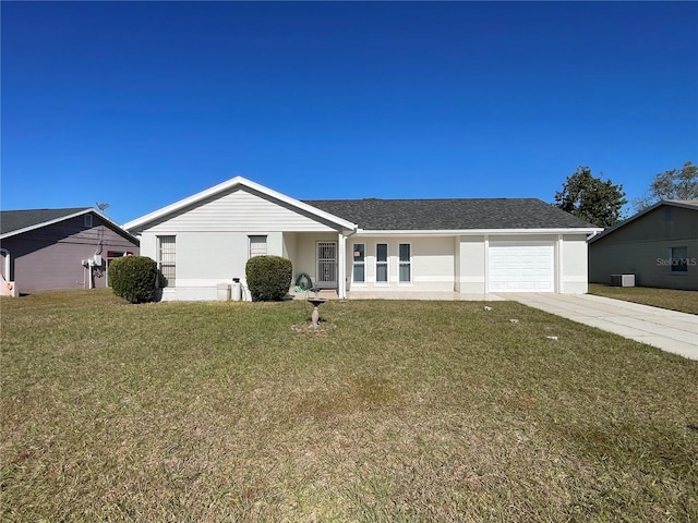 ranch-style house featuring a front yard and a garage