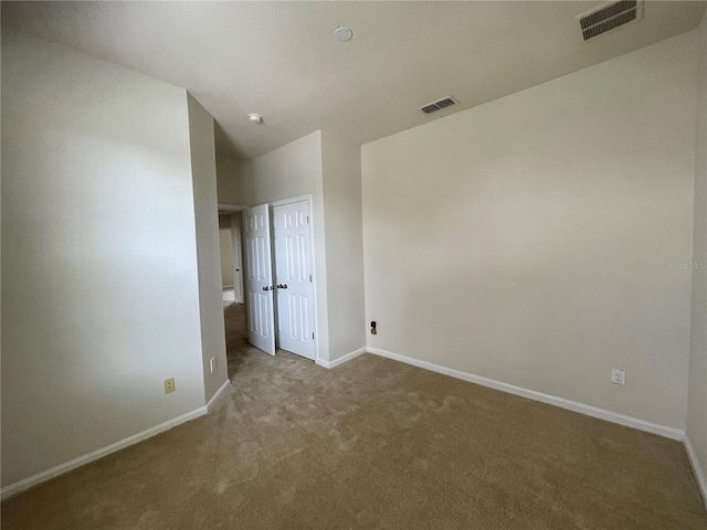 unfurnished room featuring carpet floors