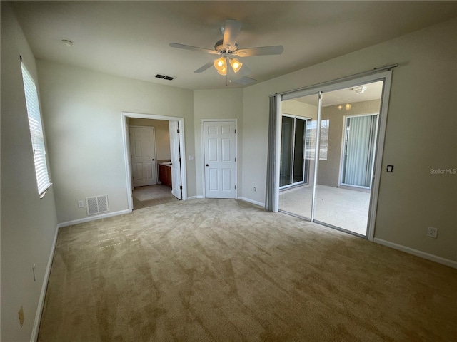 unfurnished bedroom with ceiling fan, access to outside, and light carpet