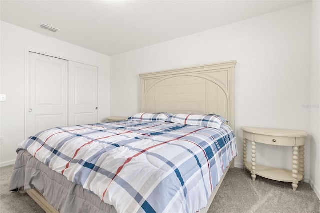 carpeted bedroom with a closet