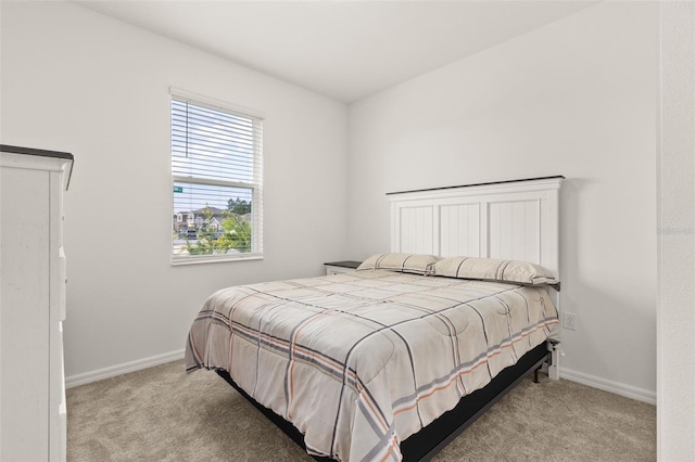 bedroom featuring light colored carpet