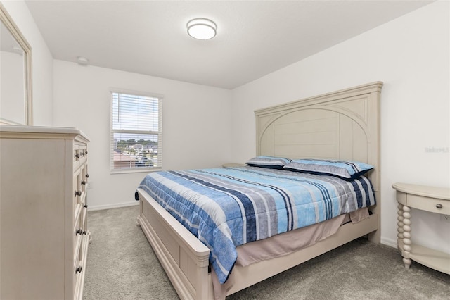 bedroom featuring light carpet