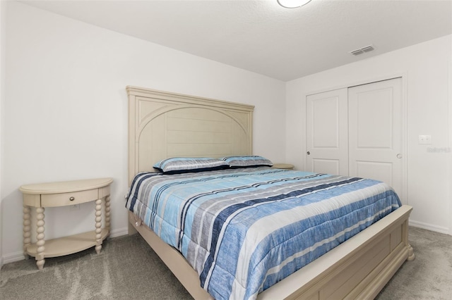 carpeted bedroom with a closet