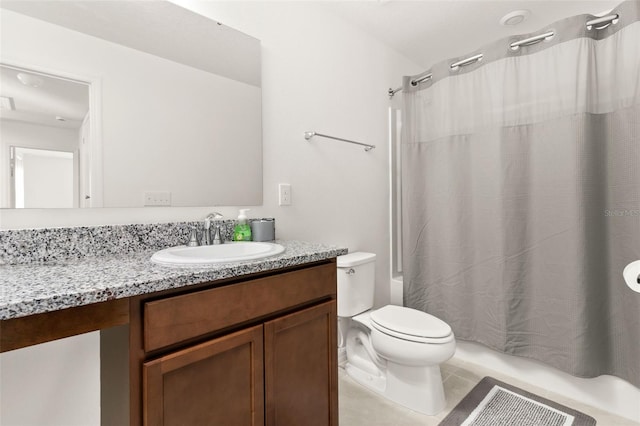 full bathroom featuring tile patterned flooring, toilet, shower / tub combo, and vanity