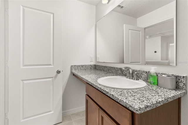 bathroom featuring vanity and tile patterned flooring