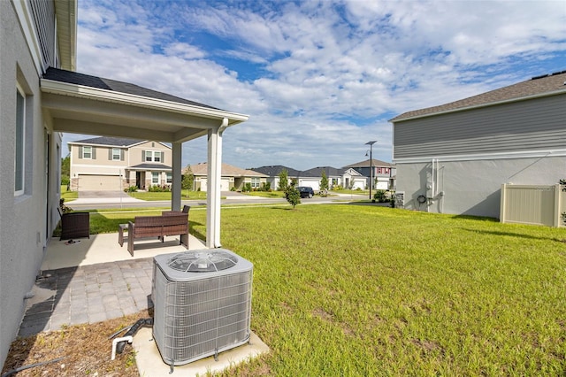 view of yard with cooling unit and a garage