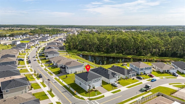 birds eye view of property featuring a water view