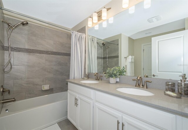 bathroom featuring vanity and shower / tub combo with curtain