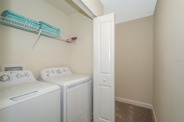 washroom featuring carpet flooring and washer and dryer