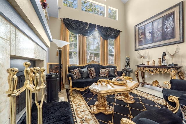 living room with a high ceiling and tile patterned flooring