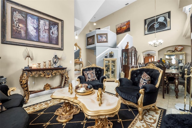 tiled living room with high vaulted ceiling and a chandelier