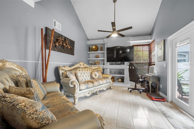 living room featuring ceiling fan, light wood-type flooring, and high vaulted ceiling