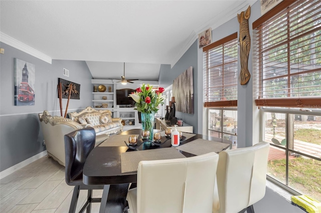 dining room with ceiling fan, light hardwood / wood-style flooring, and lofted ceiling