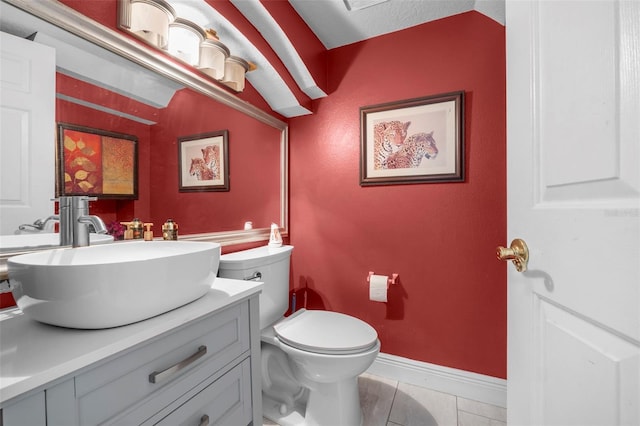 bathroom with tile patterned floors, vanity, and toilet