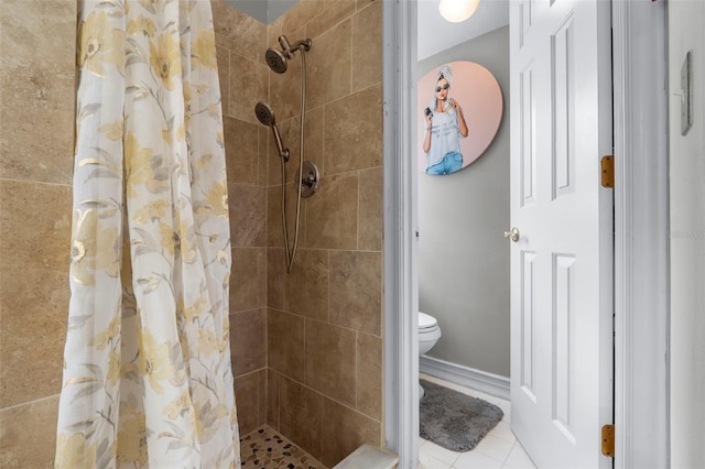 bathroom with toilet, tile patterned floors, and curtained shower