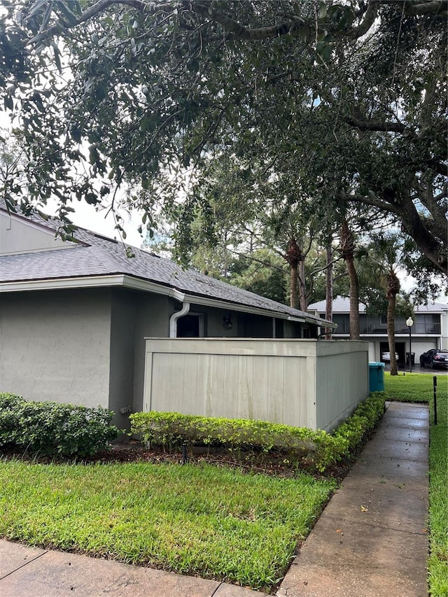 view of home's exterior featuring a yard