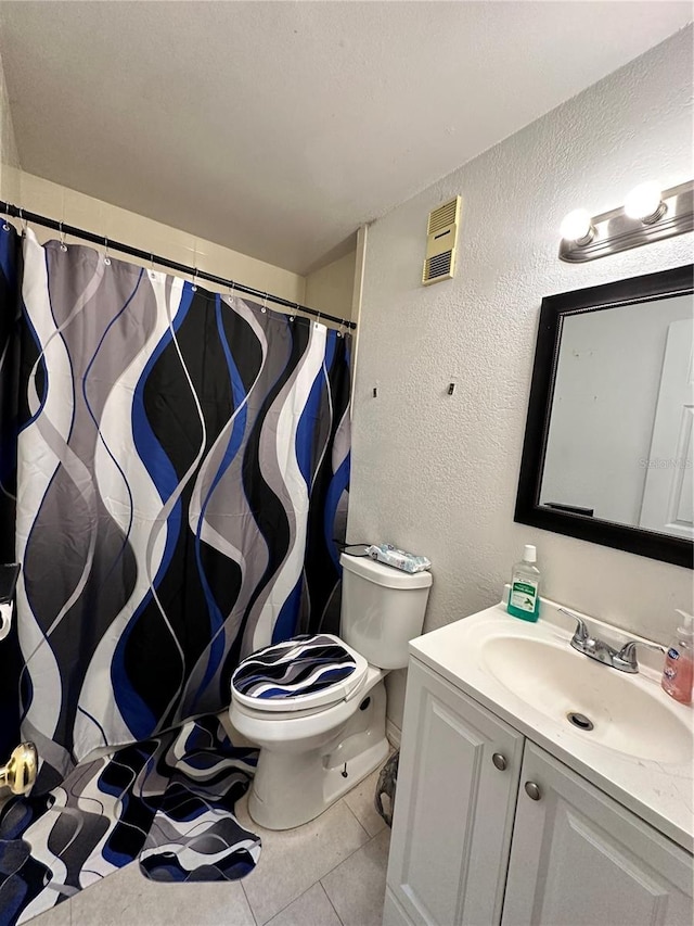 bathroom with tile patterned flooring, vanity, toilet, and a shower with shower curtain