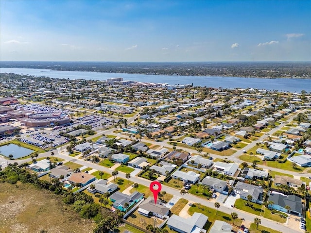 bird's eye view featuring a water view and a residential view