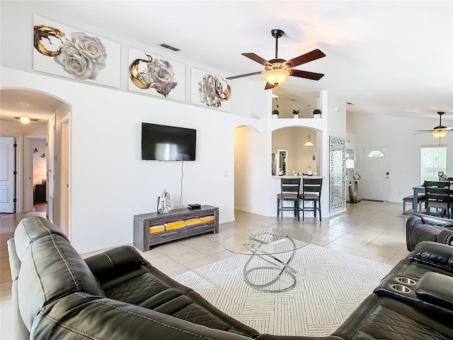 living room featuring light tile patterned floors and ceiling fan