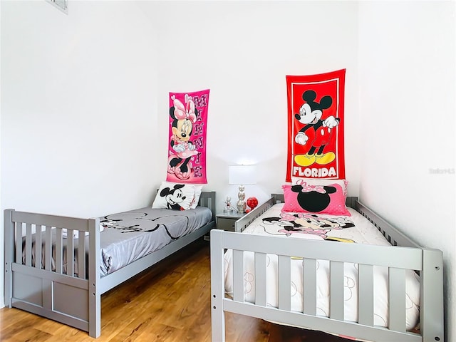 bedroom with hardwood / wood-style floors