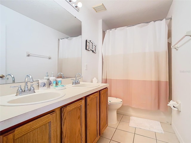 bathroom with a shower with shower curtain, tile patterned floors, toilet, and vanity