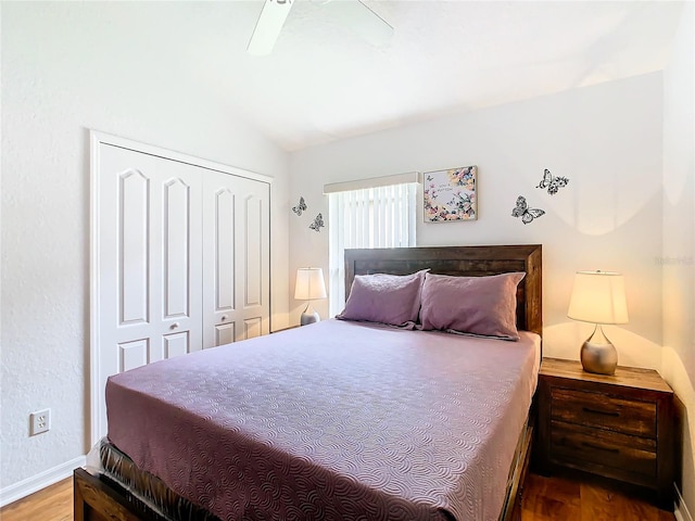 bedroom with a closet, ceiling fan, and wood-type flooring