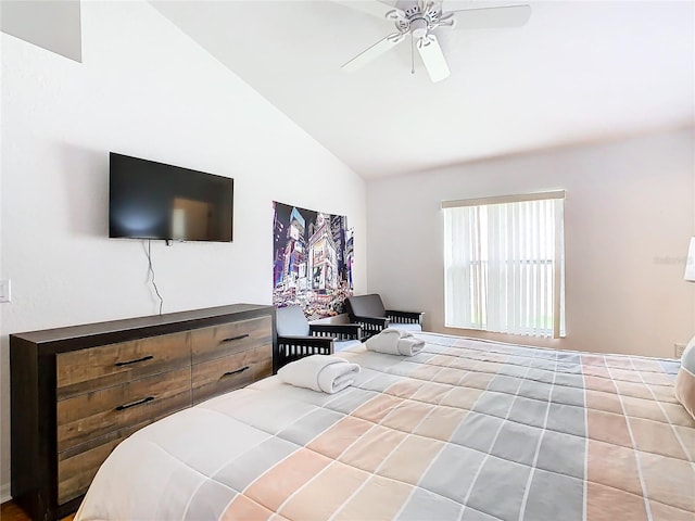 tiled bedroom with ceiling fan and vaulted ceiling