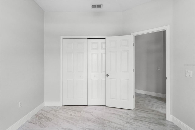 unfurnished bedroom featuring a closet