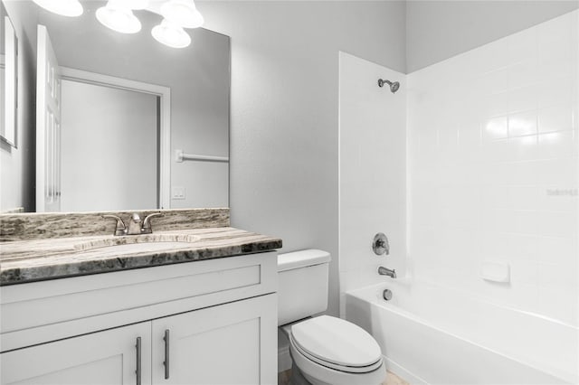 full bathroom with vanity, toilet, and tiled shower / bath combo