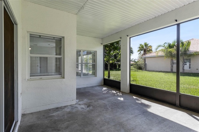 unfurnished sunroom with a wealth of natural light