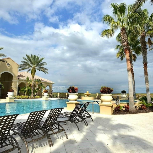 view of pool featuring a patio area