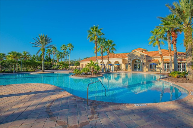 view of swimming pool with a patio