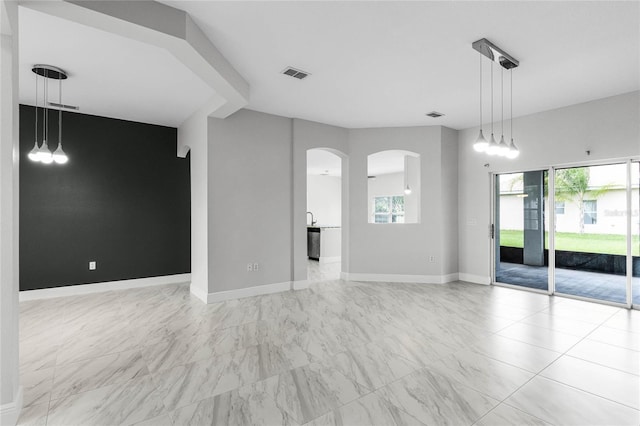 unfurnished living room featuring a wealth of natural light