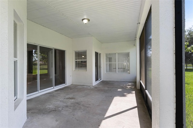 unfurnished sunroom with a wealth of natural light