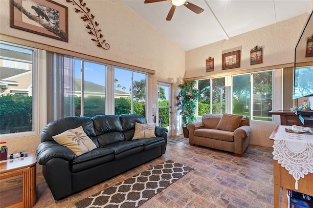 sunroom / solarium featuring vaulted ceiling and a ceiling fan