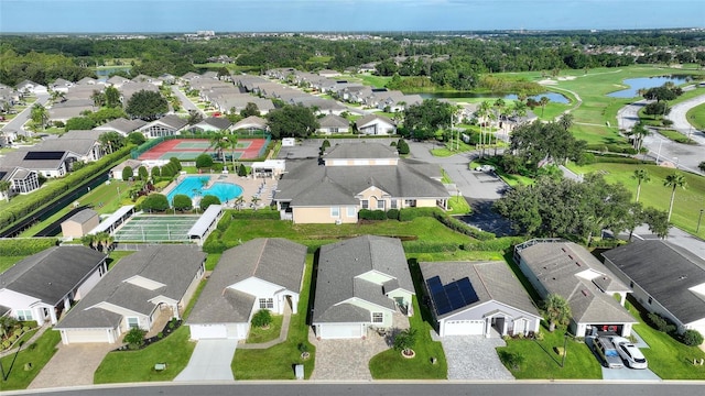 bird's eye view featuring a water view and a residential view