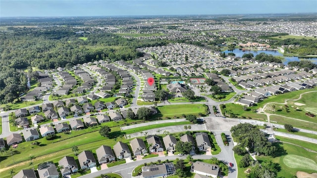 bird's eye view with a residential view, view of golf course, and a water view