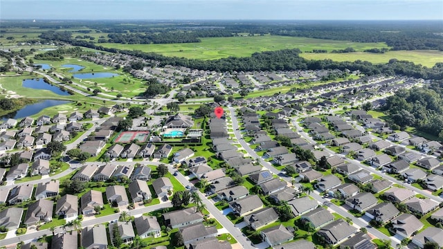 birds eye view of property featuring a water view and a residential view