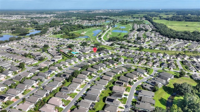 bird's eye view with a water view and a residential view