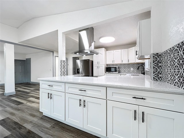 kitchen featuring light stone counters, a sink, white cabinetry, appliances with stainless steel finishes, and island exhaust hood