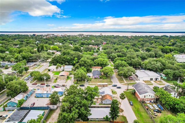 aerial view featuring a wooded view and a residential view