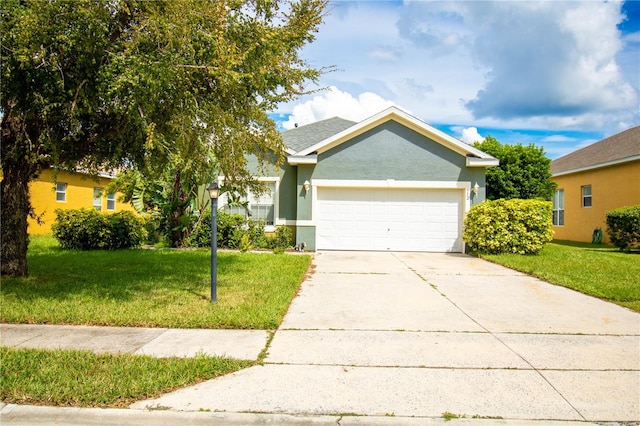 view of front of house with a front yard and a garage