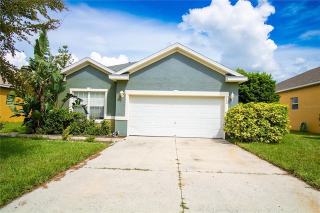 view of front facade featuring a garage and a front lawn