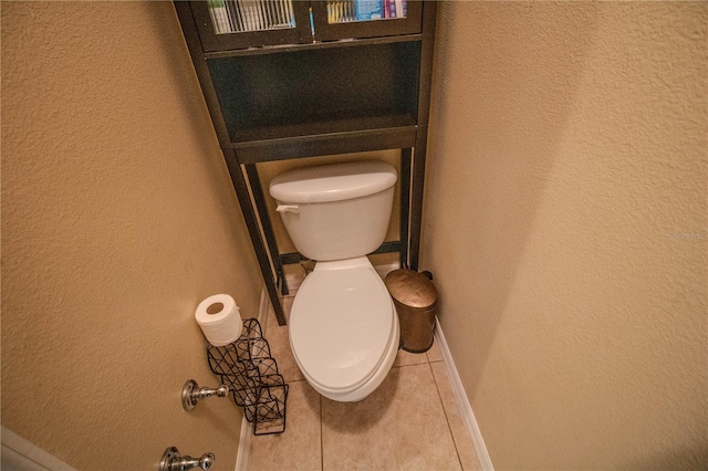 bathroom featuring tile patterned flooring and toilet