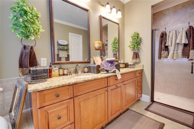 bathroom featuring tile patterned floors, a shower stall, ornamental molding, and vanity